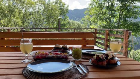 Romanian-traditional-fish-dish-with-papanas-and-drinks