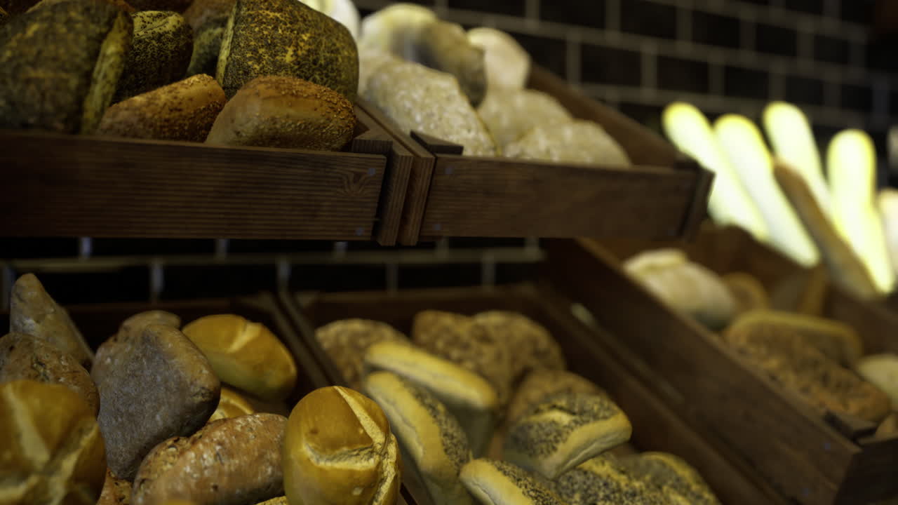 Freshly baked artisan bread in a rustic bakery display during daytime