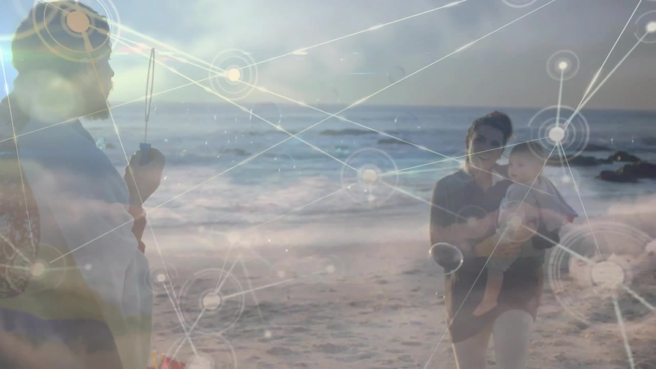 Network graphic appearing, parents holding rod and cradling baby, connecting family via tech