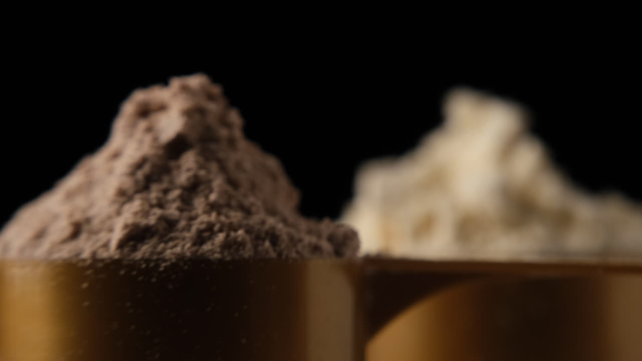 Protein powder in scoop, close up
