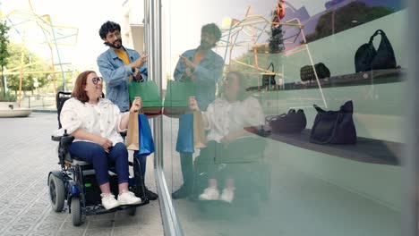 People window shopping with a person in a wheelchair