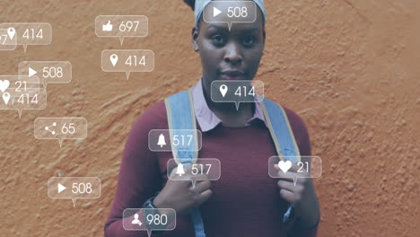 animation of icons and data processing over african american woman in city street