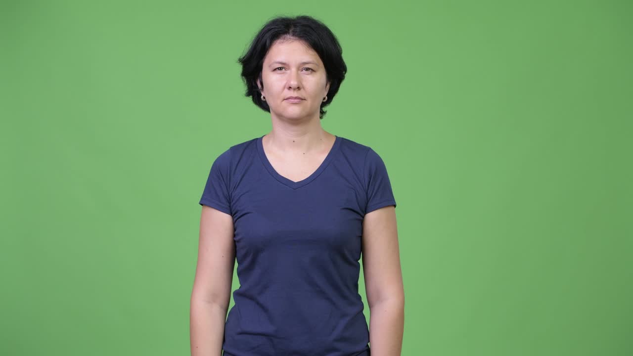 Beautiful woman covering ears as three wise monkeys concept