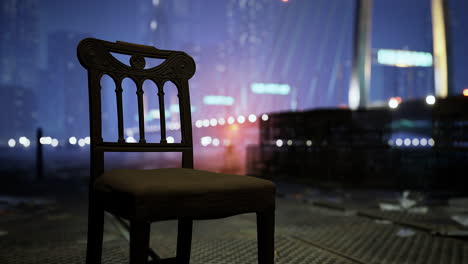 empty chair at night in a bustling city with bright lights and buildings