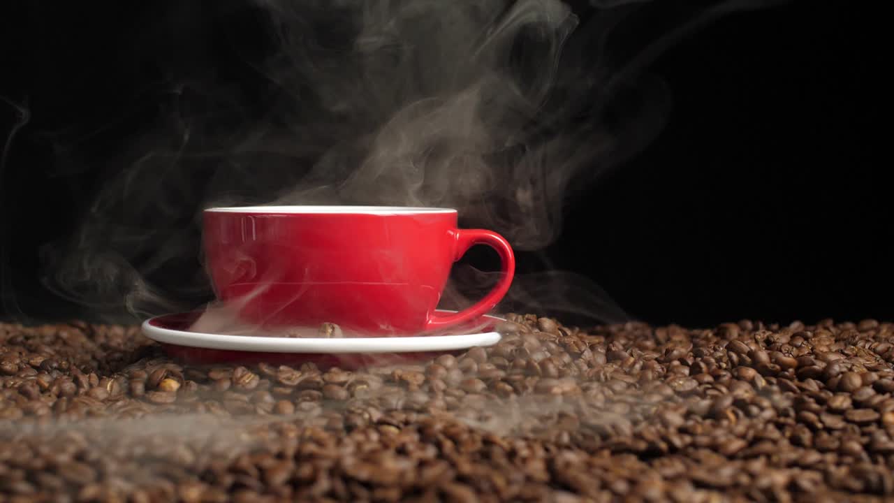 Hot Coffee In A Red Coffee Cup And Many Coffee Beans Placed Around, Slow Motion