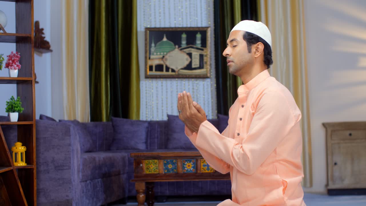A young man performs Namaz during the festival of Eid - an Islamic prayer, Ramadan, faith, belief