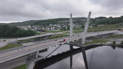 picturesque architecture of farris bridge constructed over the lake in larvik, norway on a cloudy day