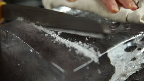 cutting a large ice cube