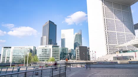 paris la defense, france, timelapse - the arch of la defense in the financial district of paris during the day