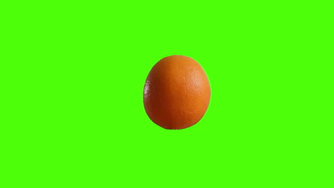 Full-Orange-Spinning-Clockwise-On-A-Green-Screen