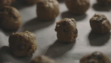 chocolate chip cookie dough on tray ready for baking