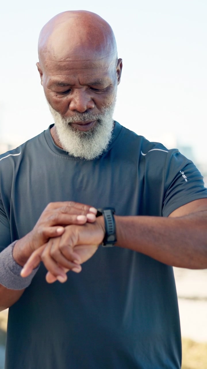Senior Man Checking His Smartwatch After Outdoor Workout