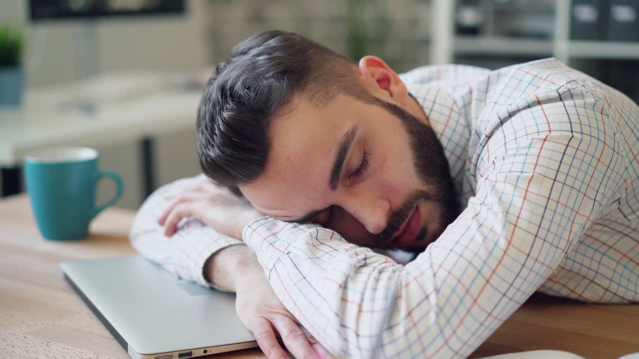 Tired Employee Napping at Desk