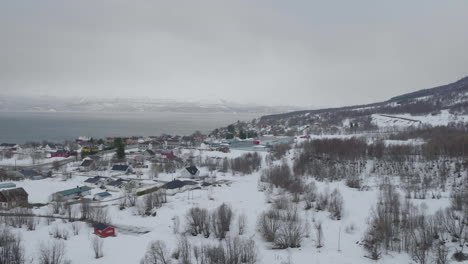 aerial view over olderdalen, village in kåfjord, norway on a cloudy winter day