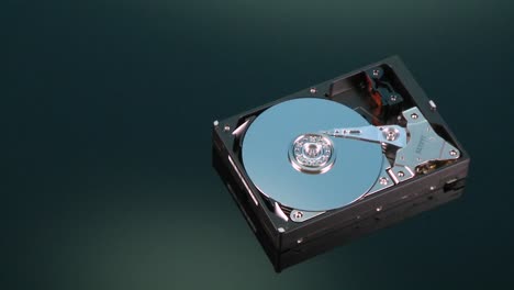 a hard drive without its cover rotates on display