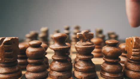 Chess pieces set game close up playing male hands