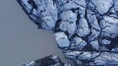 beautiful carvasses and texture of icebergs at solheimajokull - prominent and popular tourist destination in southern iceland