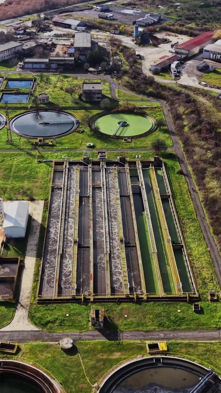 Water treatment facility showing tanks and processing areas in daylight