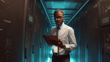 it specialist checking operational server racks work