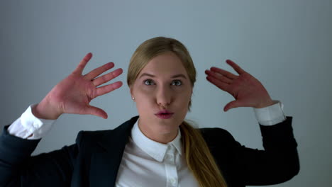 happy cheerful woman dancing in studio with white screen in slow motion,potrait