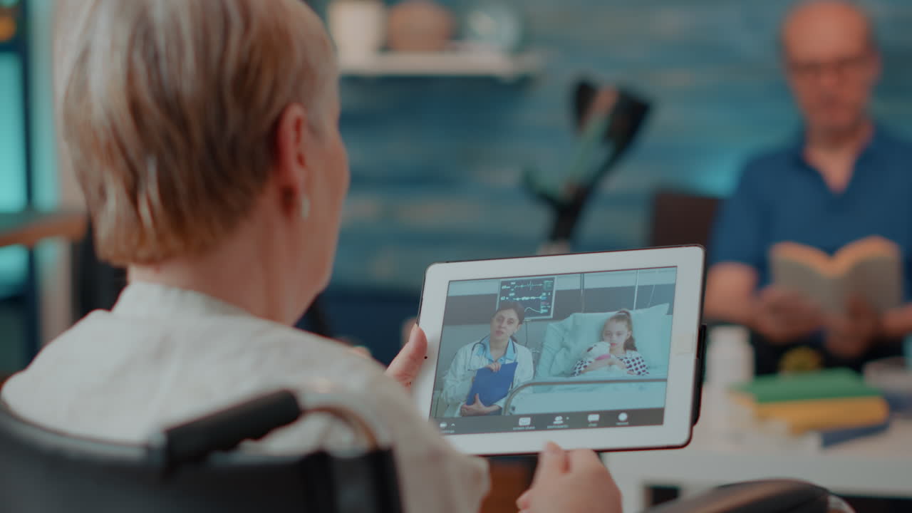 Elderly woman using telemedicine on tablet