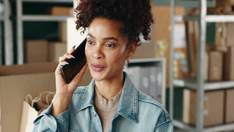 woman on phone in a small business setting