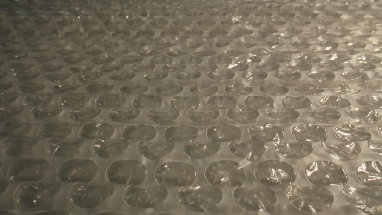 Close Up of Bubble Wrap Texture with Shifting Light Reflections