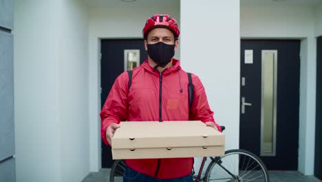 video portrait of bicycle messenger delivering pizza