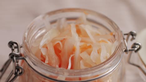 sauerkraut fermented cabbage variety preserving jars. homemade sauerkraut with carrot and salad cabbage with beetroot on a wooden table. fermented food.