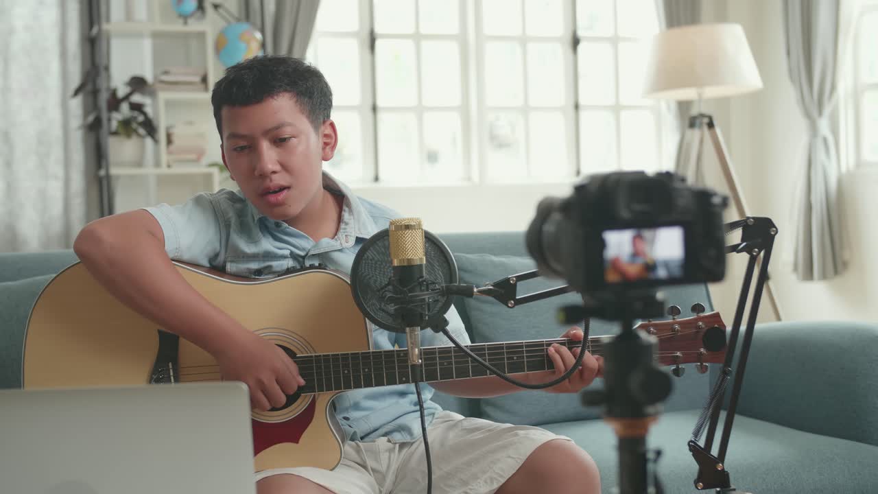 Teenager Playing Guitar and Singing a Song