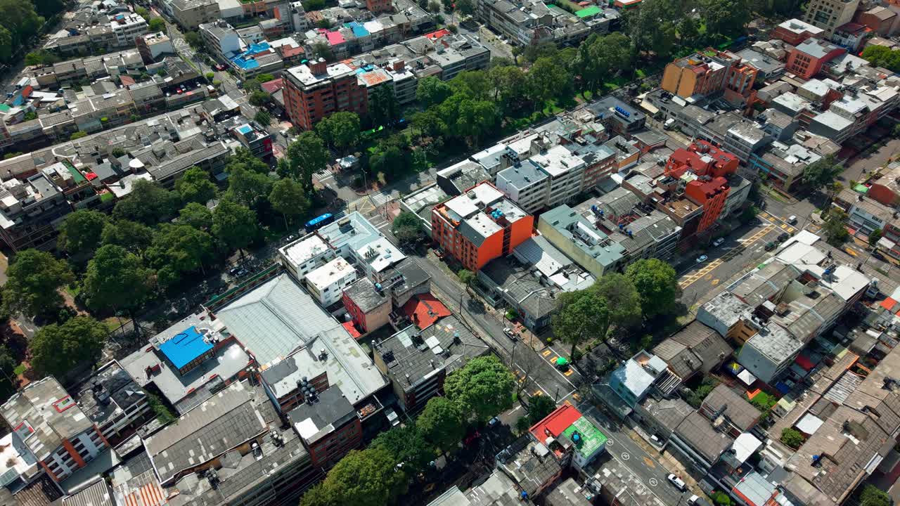 Fly over the residential neighborhood of Teusaquillo and its emblematic Parkway emblematic for recreation and green lung of the city of Bogota, Colombia.