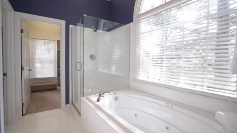 luxury white marble bathroom interior video with big window and shower in the background