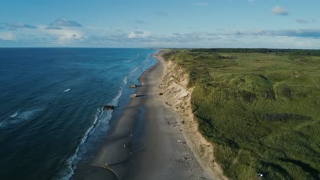 aerial view over the beach and transparent, arctic sea in norway - bird's-eye, drone shot