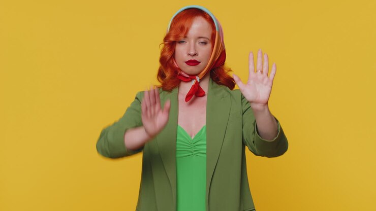 Girl say No, hold palm folded crossed hands in stop gesture, warning of finish, prohibited access