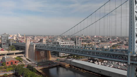 sunrise aerial drone footage of benjamin franklin bridge in philadelphia