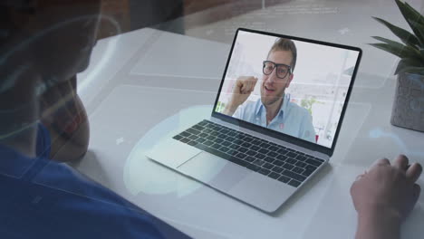 using animation, person on video call with digital interface on laptop screen