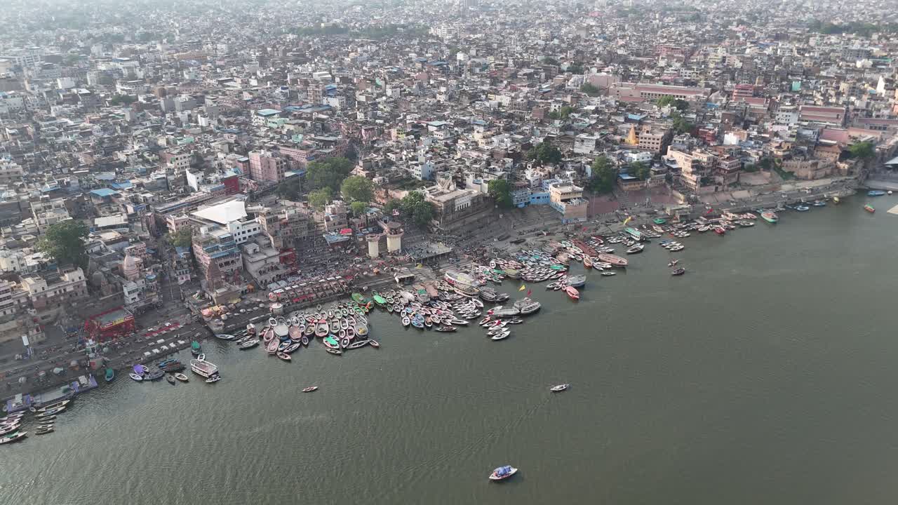 Overhead capture of Varanasi's iconic riverfront, where ancient temples rise above the bustling ghats and narrow lanes.