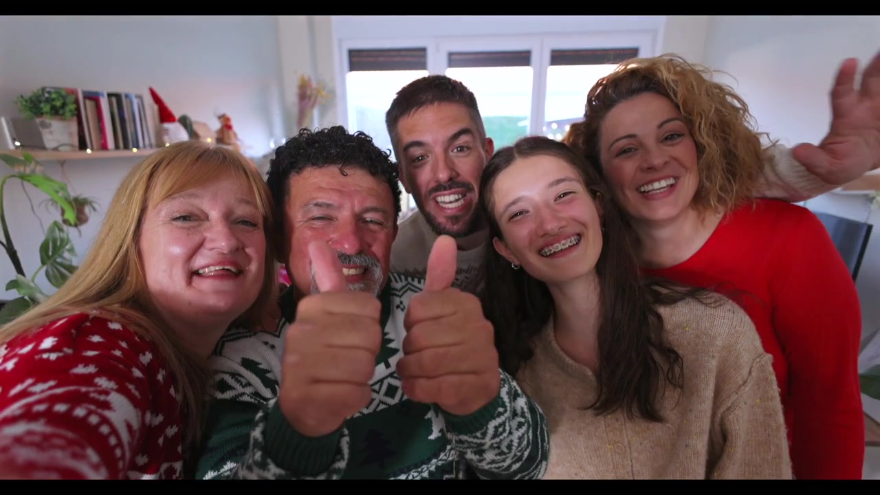 Happy Family Making Heart Gestures During Christmas Video Call