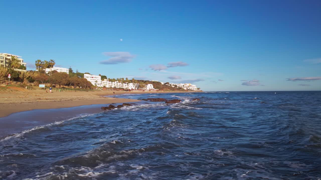 Drone moving into the sea in slow motion