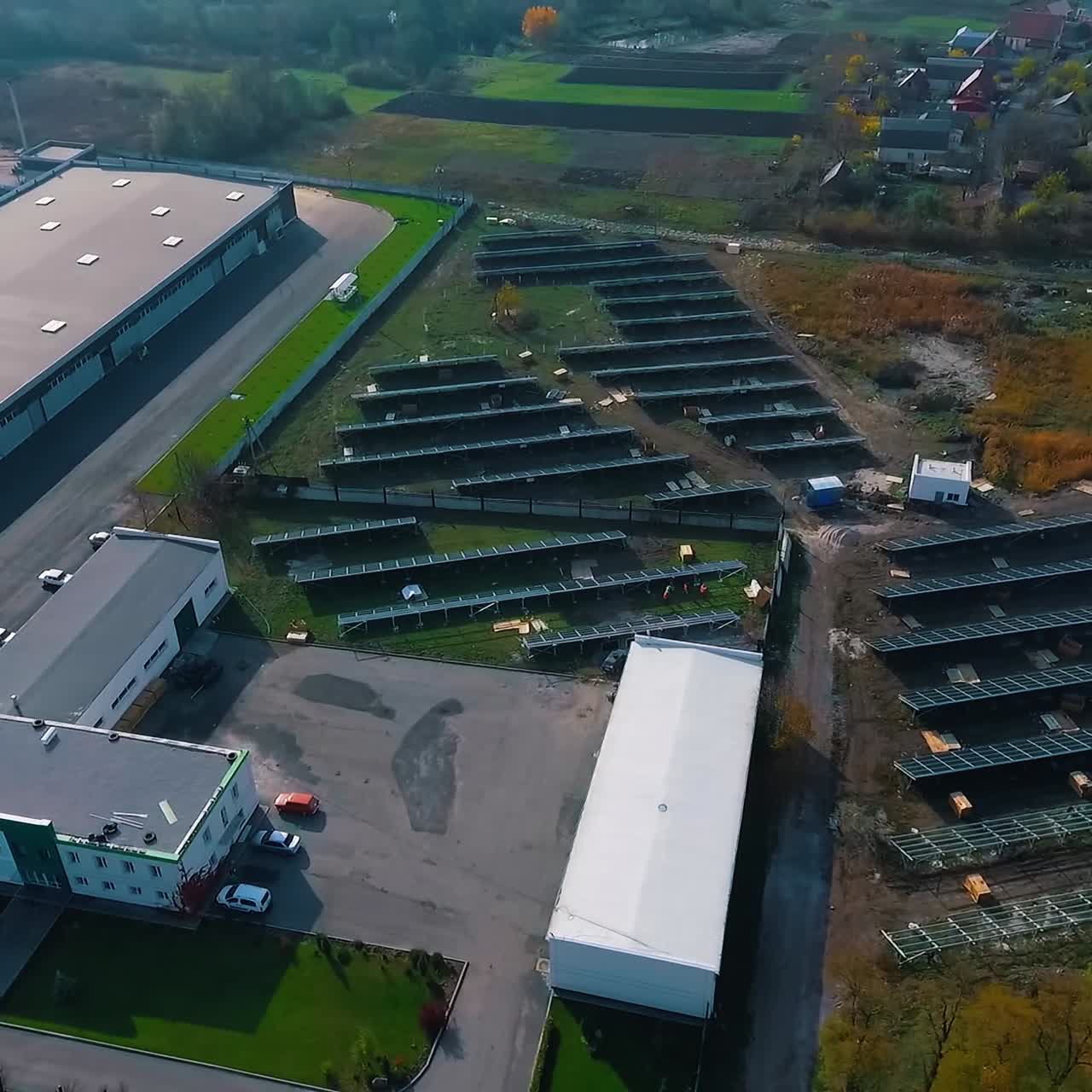 Solar panels installing on roof. Drone aerial view of modern photovoltaic electricity system