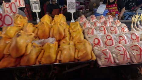 poultry displayed for sale at a market stall.