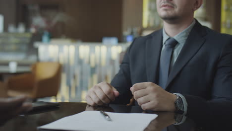 businessmen shaking hands and discussing agreement