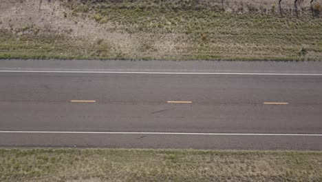 drone — looking straight down at a long stretch of texas highway