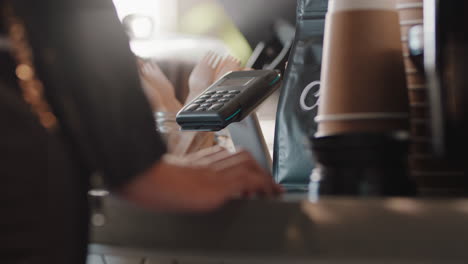 close up customer paying using smartphone buying coffee in cafe happy customer enjoying service spending money at restaurant