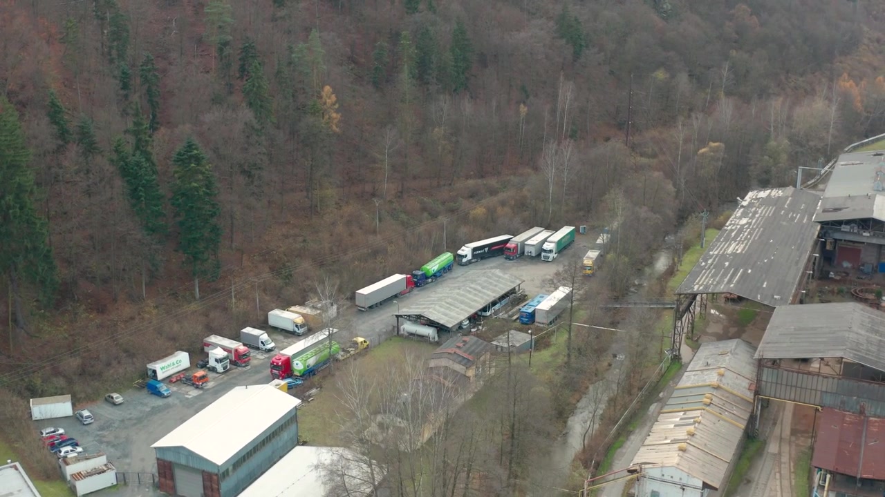 drone flying over abandon place or factory near blansko in czech republic onto pofce iling overlokingrriver trains nruins