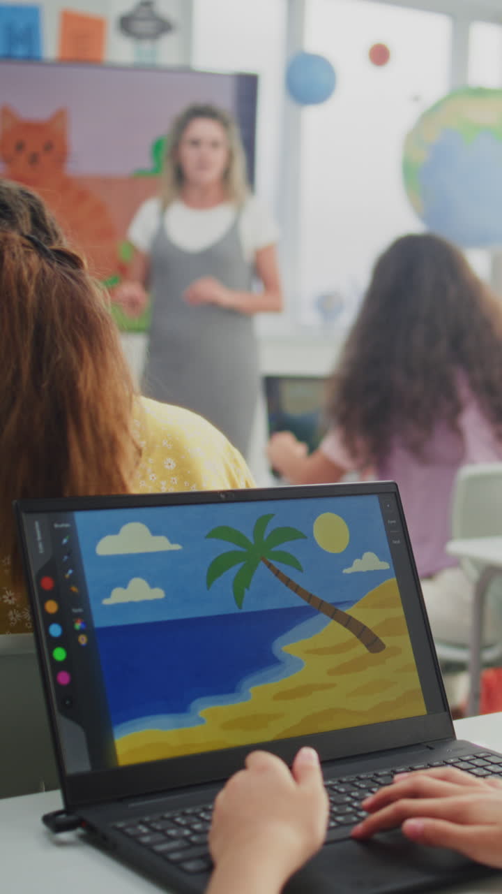 Teacher Educating Young Students Elementary School Children Drawing Pictures on Laptops