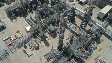 Aerial-footage-of-a-large-scale-Oil-refinery-with-smoke-stacks-and-petroleum-storage-tanks