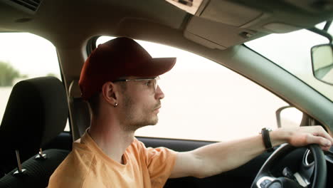 man driving car