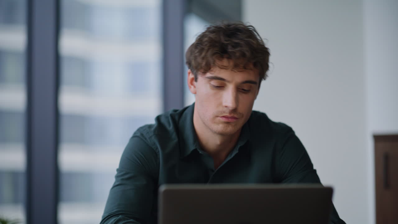 Disappointed worker reading report worried financial result in office closeup