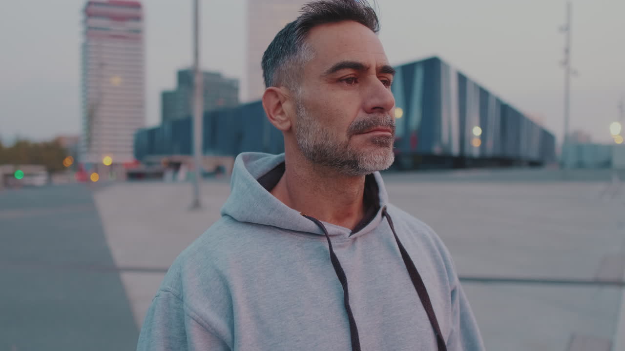 Man in hoodie in an urban setting